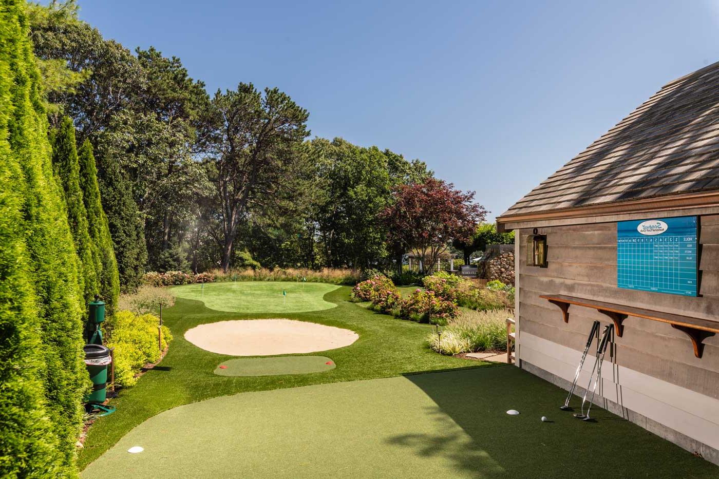 putting green next to a house